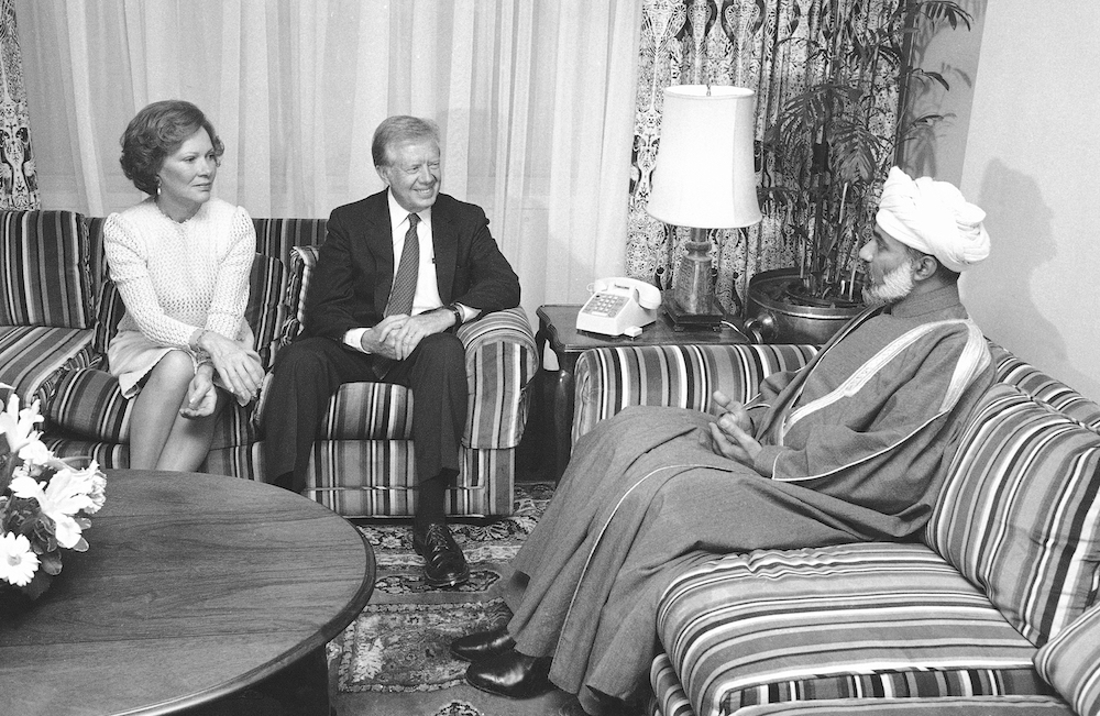 President Jimmy Carter and Rosalynn Carter meet Sultan Qaboos in Washington in 1983. (AP/File)