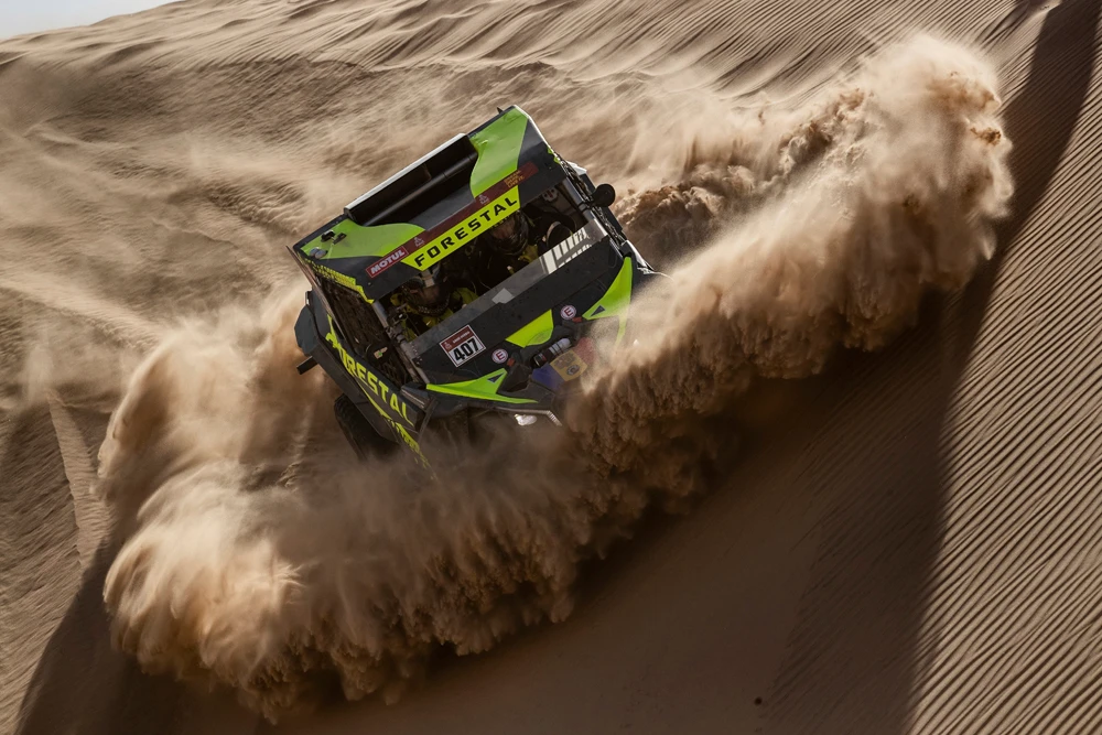 Driver Denis Berezovskiy, of Kazakhstan, and co-driver Adrian Torlaschi, of Argentina, race their Can-Am during Stage 8 of the Dakar Rally in Wadi Al Dawasir. (AP Photo)