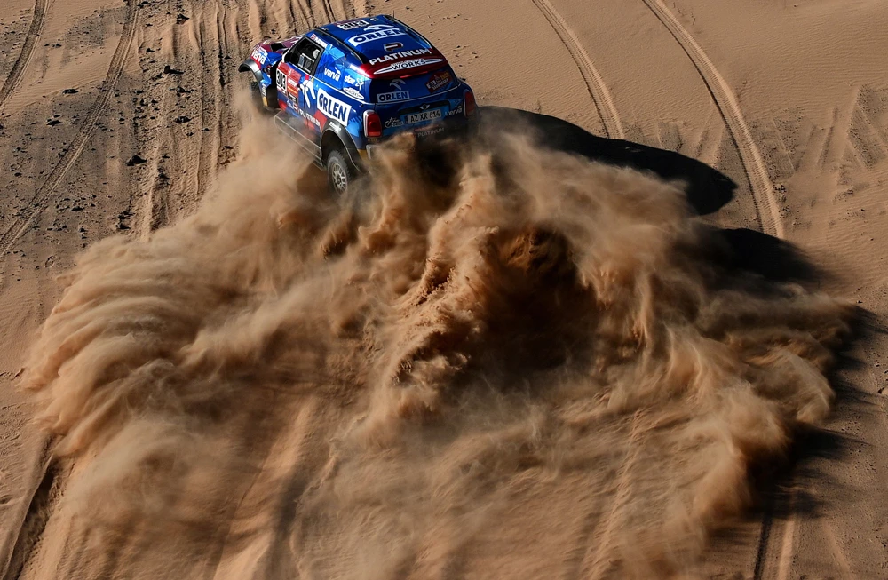 Mini’s driver Jakub Przygonski of Poland and his co-driver Timo Gottschalk of Germany compete in Stage 8 of the Dakar 2020 around Wadi Ad-Dawasir. (AFP)