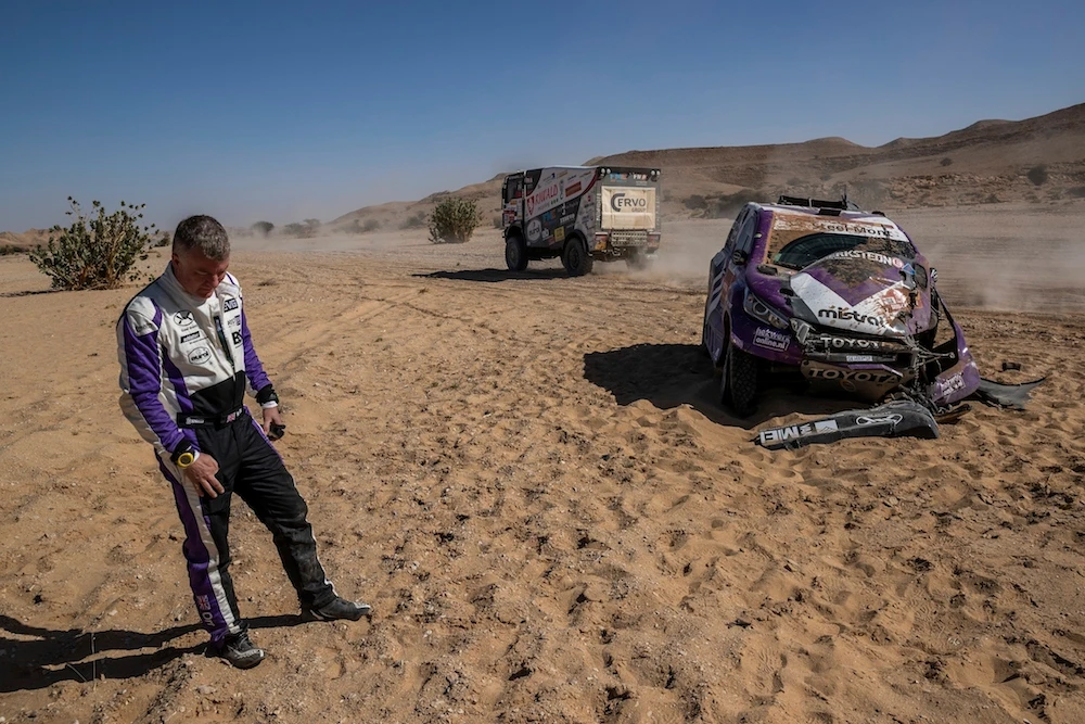 Co-driver Michael Orr, of Great Britain, after crashing his Toyota during stage nine of the Dakar Rally between Wadi Al Dawasir and Haradth, Saudi Arabia, Tuesday, Jan. 14, 2020. (AP)