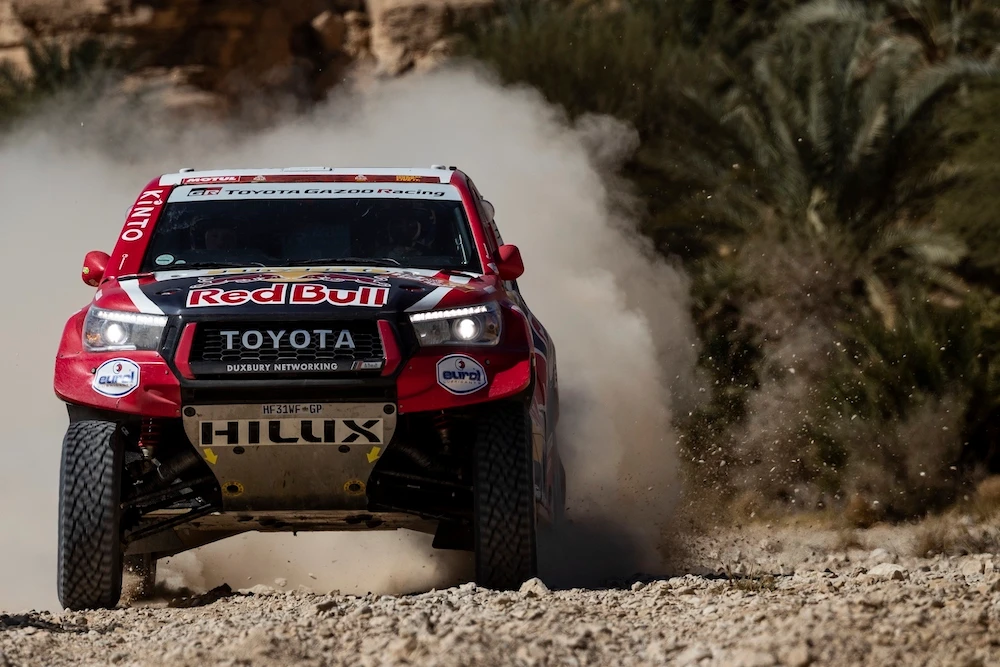 Driver Nasser Al-Attiyah, of Qatar, and co-driver Matthieu Baumel, of France, race their Toyota during stage nine of the Dakar Rally between Wadi Al Dawasir and Haradth, Saudi Arabia, Tuesday, Jan. 14, 2020. (AP)