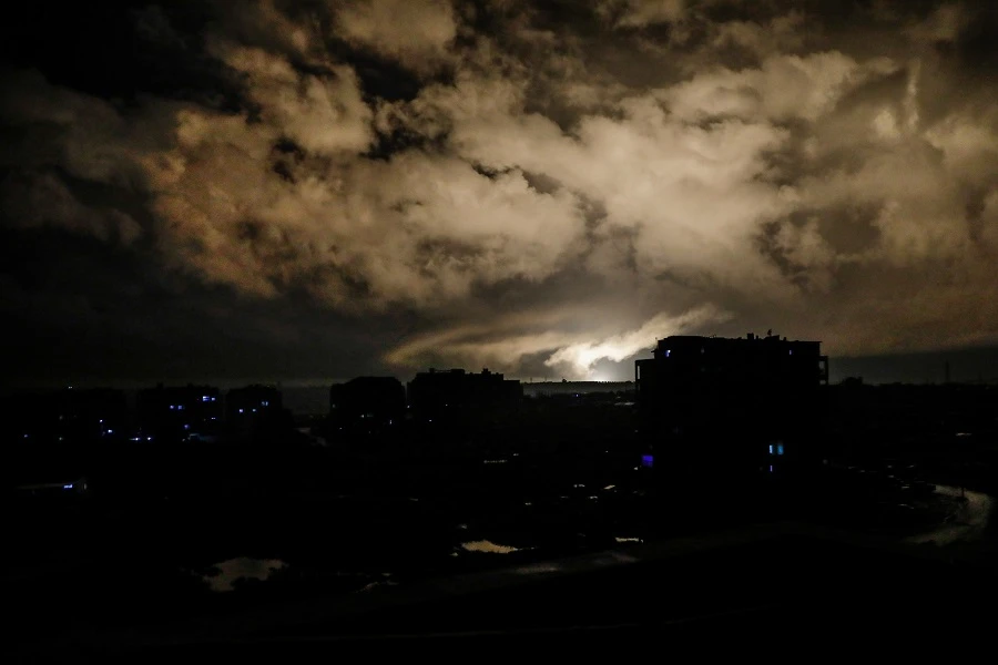 An explosion, from an air-strike, lights the sky above the rebel-held city of Idlib in northwestern Syria on Jan. 1, 2020.(Abdullah Hammam/AFP)