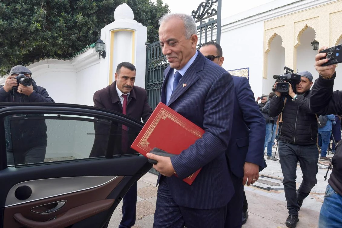 Tunisia's prime minister-designate Habib Jemli, tasked with forming a government, leaves his office in the capital Tunis on December 30, 2019. (AFP)
