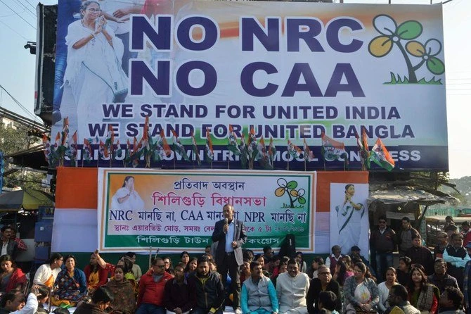 Supporters and activists of the Trinamool Congress (TMC) take part in a sitting demonstration against India's new citizenship law, in Siliguri on December 28, 2019. (AFP)