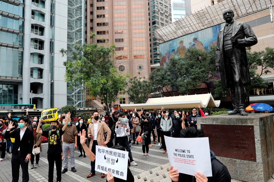 HSBC closes Hong Kong branches after protesters launch graffiti raids