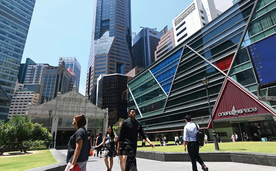 Singapore’s central bank eased monetary policy in October for the first time in three years as the export-oriented economy struggled in the face of global trade tensions and a downturn in the electronics sector. (AFP)