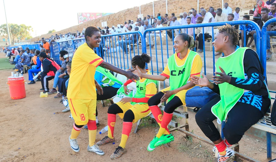 In this Wednesday, Dec. 11, 2019 photo, Sudanese , al-Difaa players sit on the bench durin a game with al-Difaa women teams in Omdurman, Khartoum's twin city, Sudan. (AP)