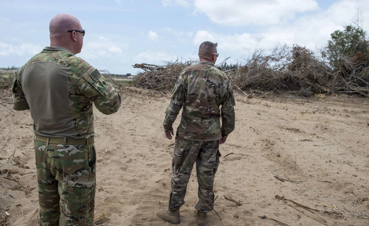In this photo taken Feb. 24, 2018 and released by the U.S. Air Force, U.S. Air Force Lt. Col. Vance Goodfellow, left, 475th Expeditionary Air Base Squadron (EABS) commander, and U.S. Army Lt. Col. (AP)