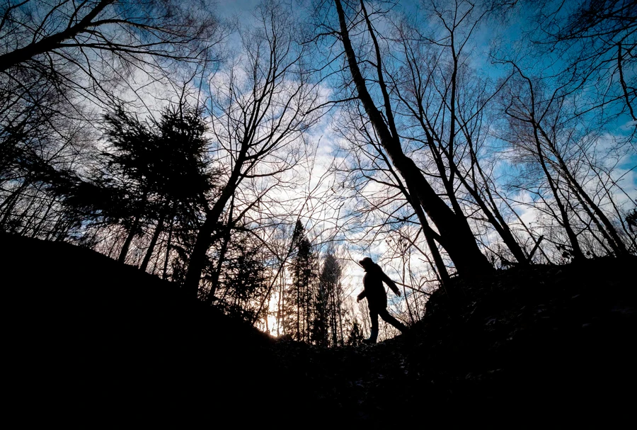 A woman walks in the Izmailovsky park in Moscow on January 5, 2020. Climate change poses risks to public health, endangers permafrost, increases the likelihood of infections and natural disasters. (AFP)
