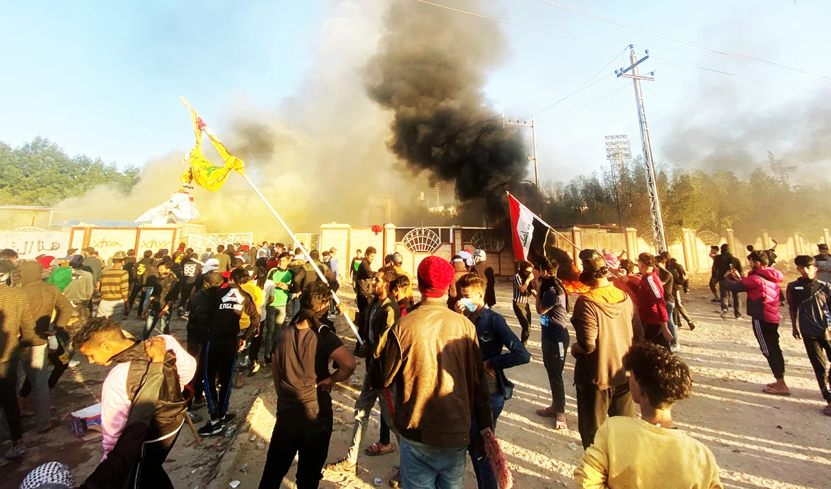 A building of the Popular Mobilization Forces (Hashd Al-Shaabi) burns after being torched by demonstrators during ongoing anti-government protests, in Nassiriya. (Reuters)