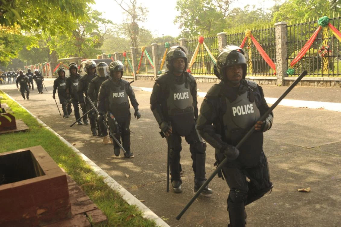 Police officers are seen outside Monrovia's Capitol building while members of the Council of Patriots (COP) protest against the deepening economic crisis under Liberian President George Weah, in Monrovia on January 6, 2020. (AFP)