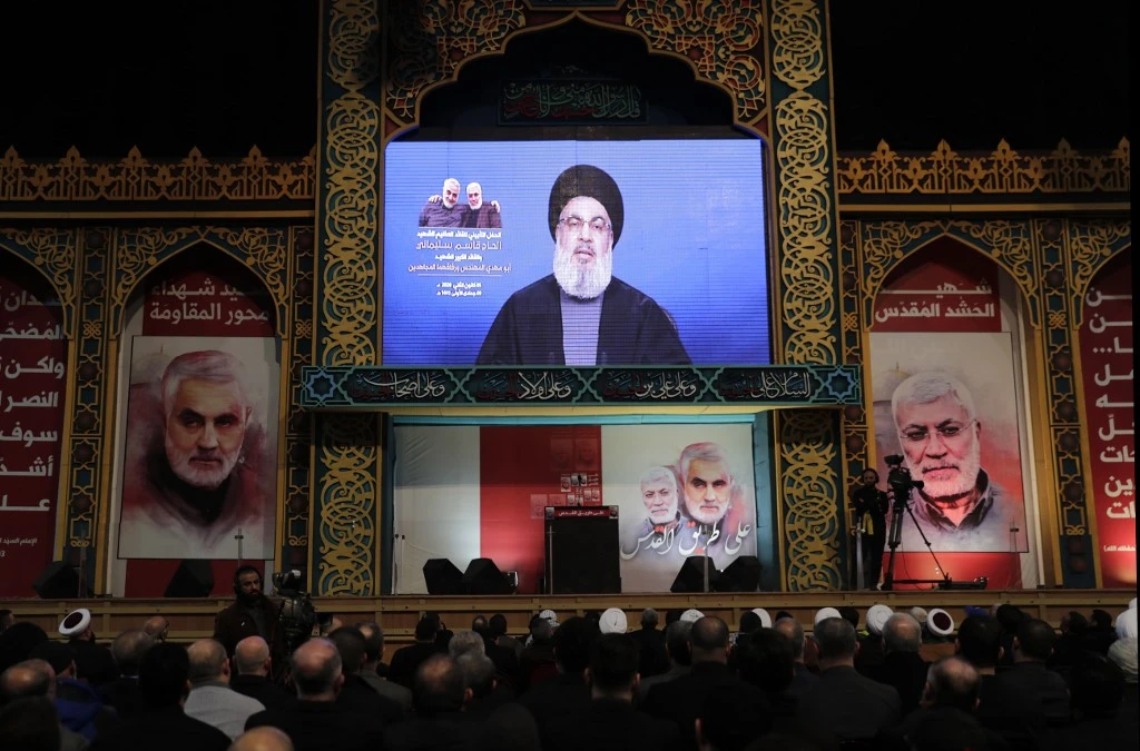 Hasan Nasrallah delivers a speech to the supporters of Hezbollah in Lebanon to commemorate the death of Qassem Soleimani. (AFP)