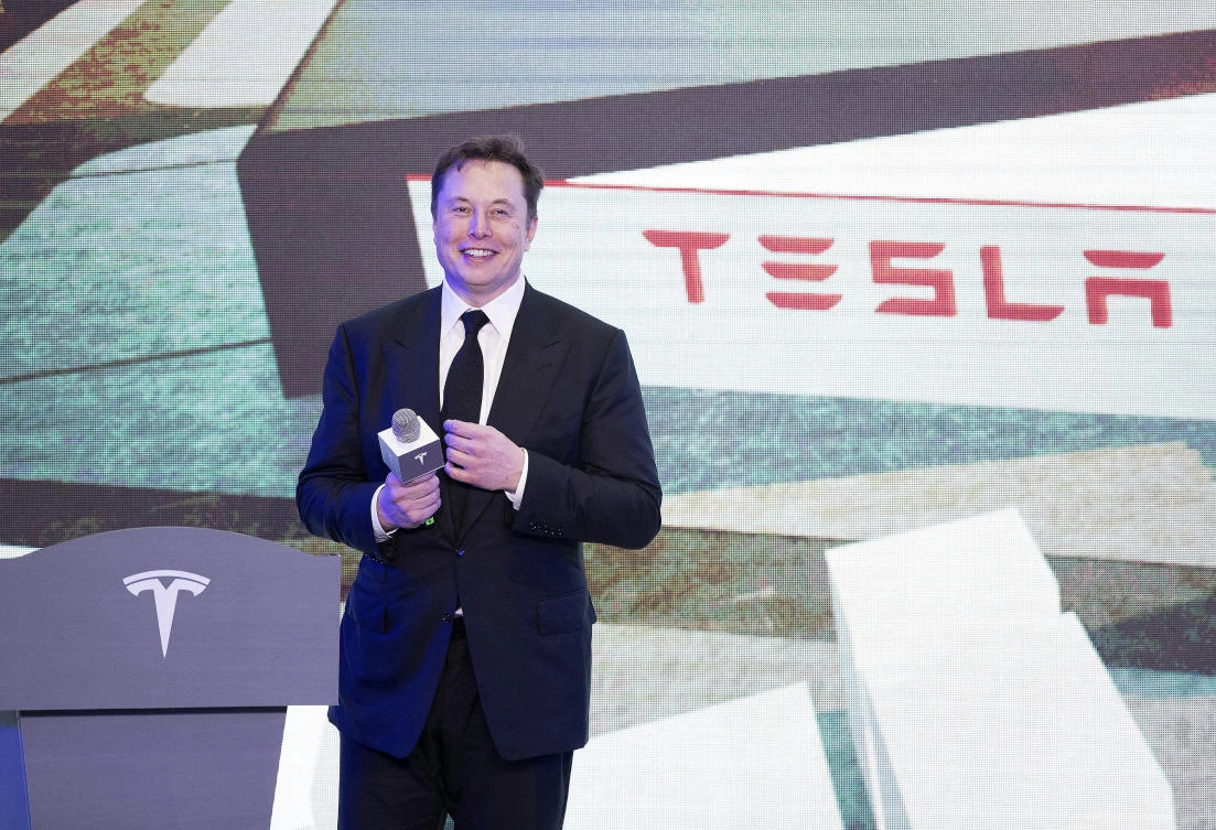 In this photo released by China's Xinhua News Agency, Tesla CEO Elon Musk speaks at a delivery ceremony for the first Tesla Model 3 cars made at Tesla's Shanghai factory in Shanghai, Tuesday, Jan. 7, 2020. ( AP)
