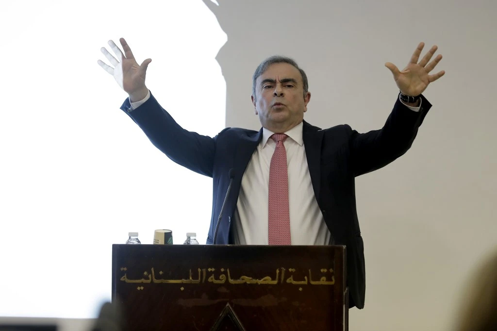 Former Renault-Nissan boss Carlos Ghosn gestures as he addresses a journalists on his reasons for escaping trial in Japan, where he is accused of financial misconduct in Beirut on January 8, 2020. (AFP)