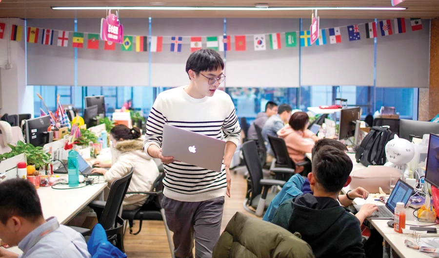 Employees work at AliExpress office at the Alibaba company’s headquarters in Hangzhou. (Reuters)