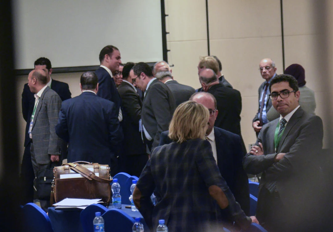 Delegates discuss amongst themselves after a closed-door session at the end of the fourth and final round of talks between Ethiopia, Egypt and Sudan on Ethiopia's construction of a controversial dam on the Nile River, in Addis Ababa, Ethiopia Thursday, Jan. 9, 2020. (AP)