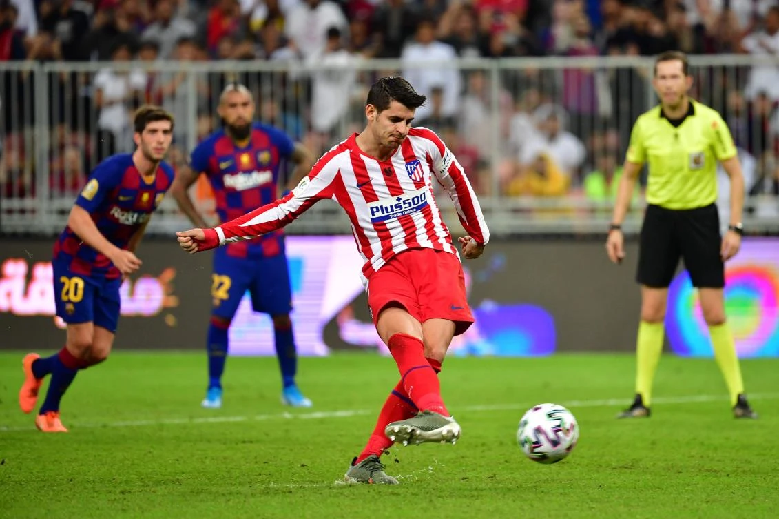 Atletico Madrid's Spanish forward Alvaro Morata takes a penalty during the Spanish Super Cup semi final between Barcelona and Atletico Madrid on January 9, 2020, at the King Abdullah Sport City in the Saudi Arabian port city of Jeddah. (AFP)