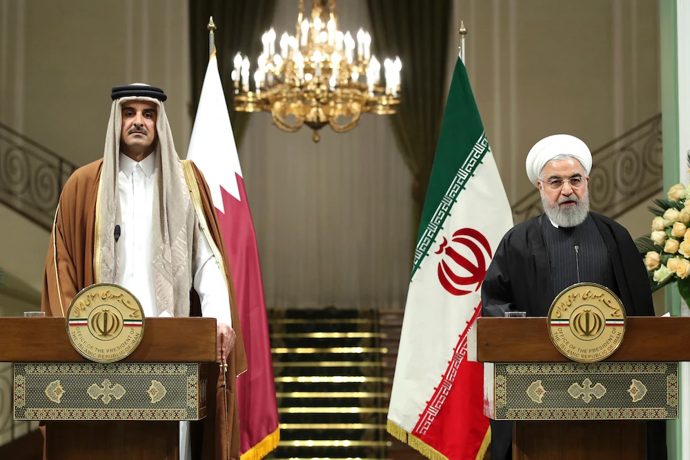 President Hassan Rouhani, right, speaks during a joint press briefing with the Emir of Qatar Sheikh Tamim bin Hamad Al Thani, after their meeting, at the Saadabad Palace in Tehran, Iran, Sunday. (Iranian Presidency Office via AP)