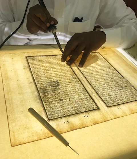A specialist in restoration working on a historical material during the treatment process, at King Salman bin Abdul Aziz Center for Historical Materials Conservation. (Photo/Supplied)