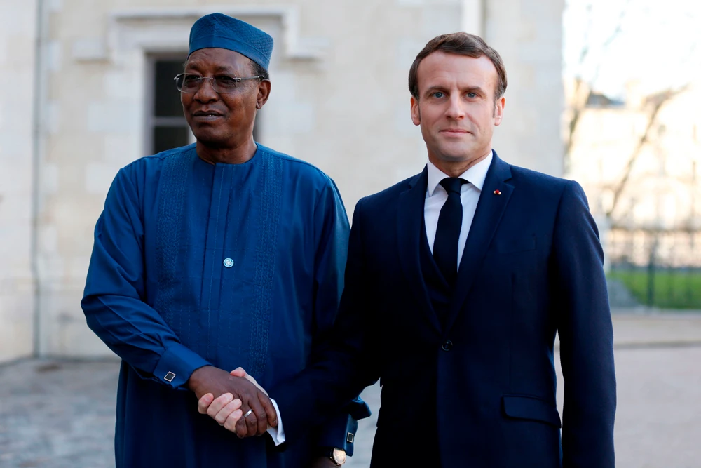 French President Emmanuel Macron welcomes Chad’s President Idriss Deby during a summit on the situation in the Sahel region in the southern French city of Pau. (AFP)