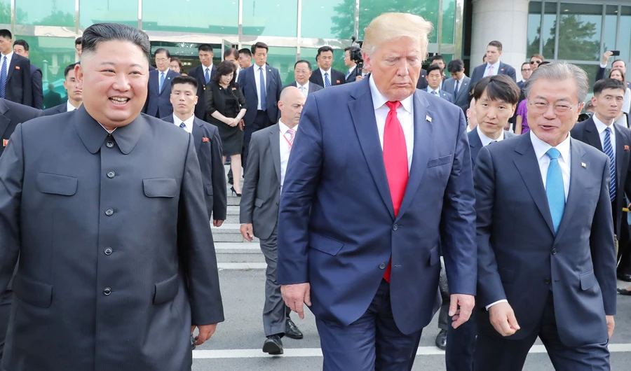 US President Donald Trump, North Korean leader Kim Jong Un and South Korea's President Moon Jae-in meet at the demilitarized zone separating the two Koreas, in Panmunjom, South Korea, June 30, 2019. (Reuters)