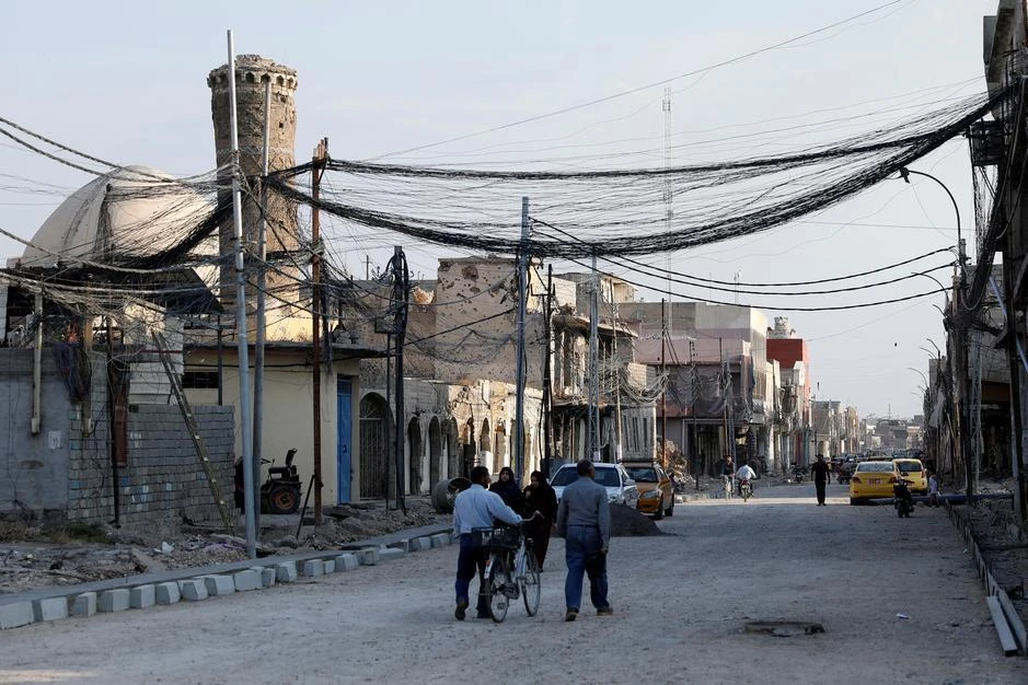 People walk on the street, where Islamic State leader Abu Bakr al-Baghdadi declared his caliphate back in 2014, in the old city of Mosul, Iraq, October 27, 2019. (Reuters)