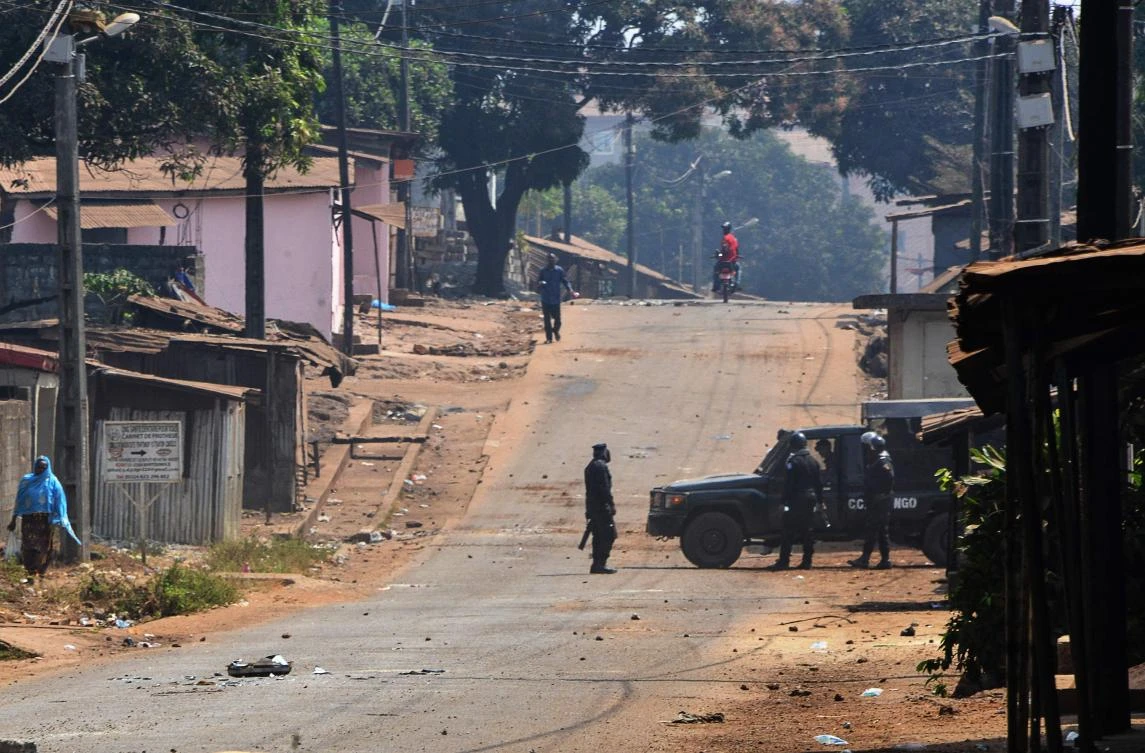 Guinean police patrol in Conakry on January 14, 2020, on the second day of open-ended protests against the president’s suspected bid to prolong his rule. (AFP)