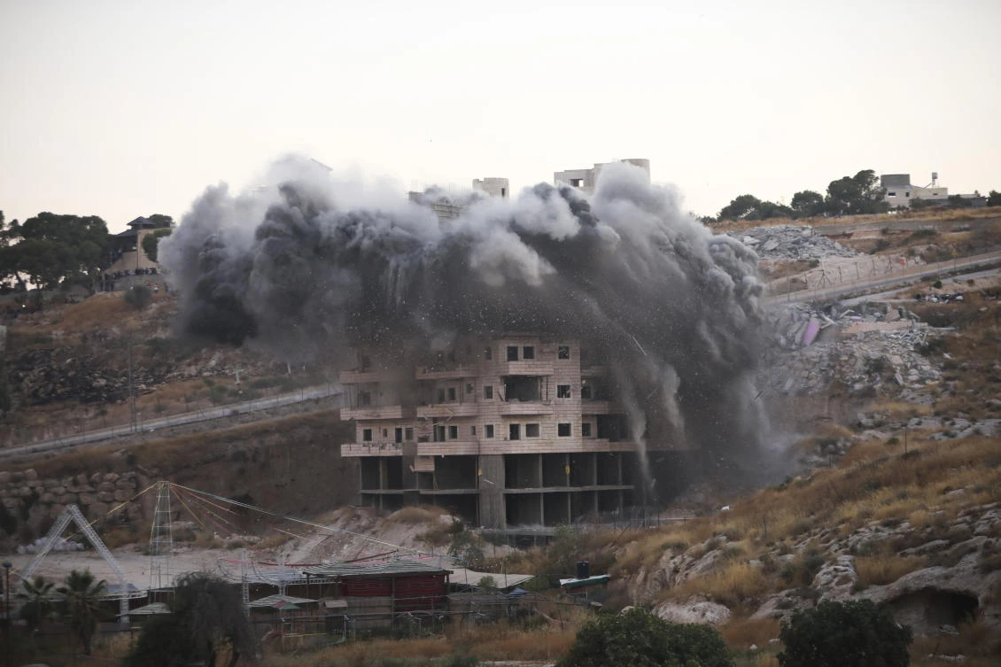 In this Monday, July 22, 2019 file photo, Israeli forces blow up a building in a Palestinian village of Sur Baher, east Jerusalem. (AP)