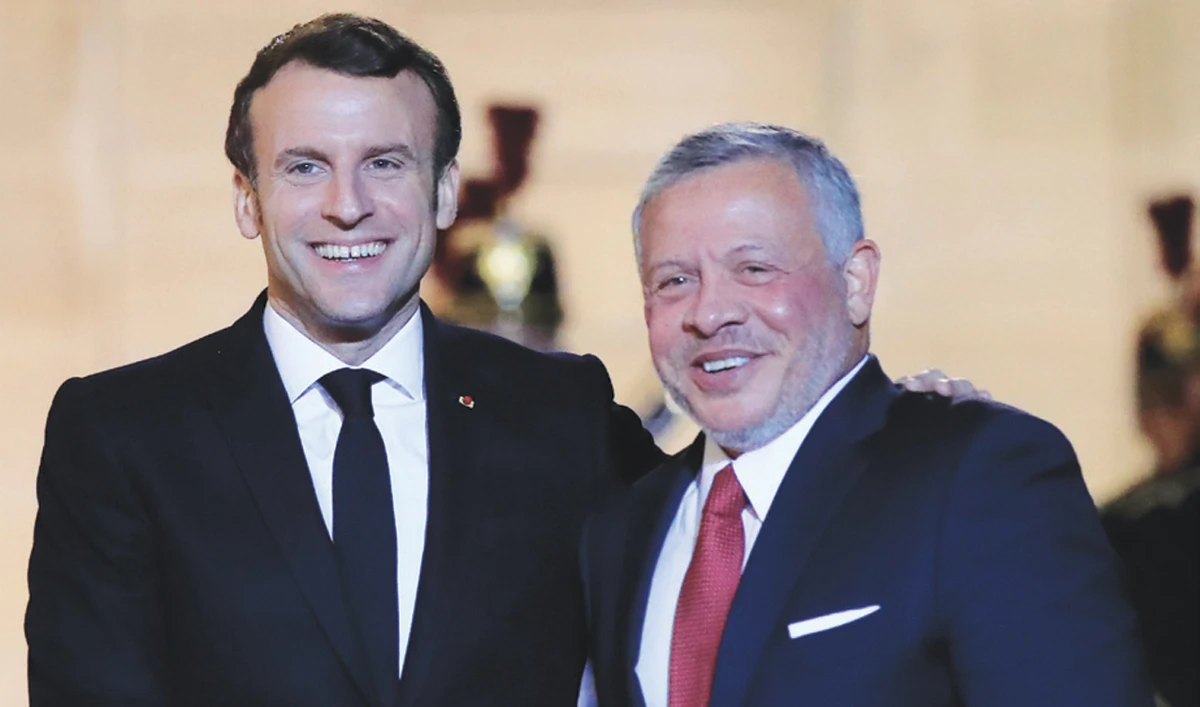 French President Emmanuel Macron, left, welcomes Jordan’s King Abdullah at the Elysee Palace. (AP)