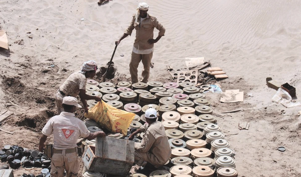 A Yemeni demining unit prepares to destroy unexploded bombs and mines collected from conflict areas near the southern port city of Aden. (Reuters)