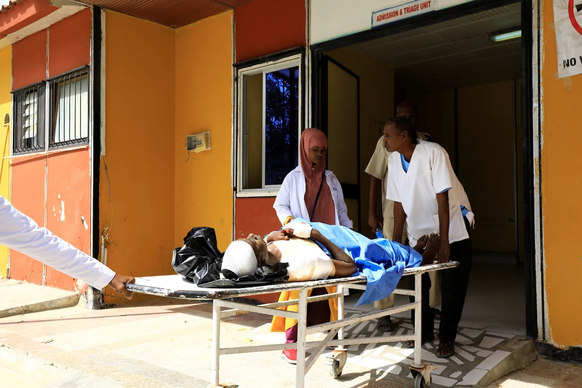 Paramedics at the Madina hospital assist an unidentified man injured in an explosion in Afgoye, as he arrives for medical attention in Mogadishu, Somalia January 18, 2020. (Reuters)