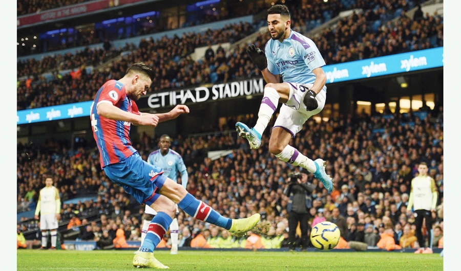 Manchester City’s Algerian midfielder Riyad Mahrez leaps during Saturday’s match against Crystal Palace at the Etihad Stadium in England. (AFP)