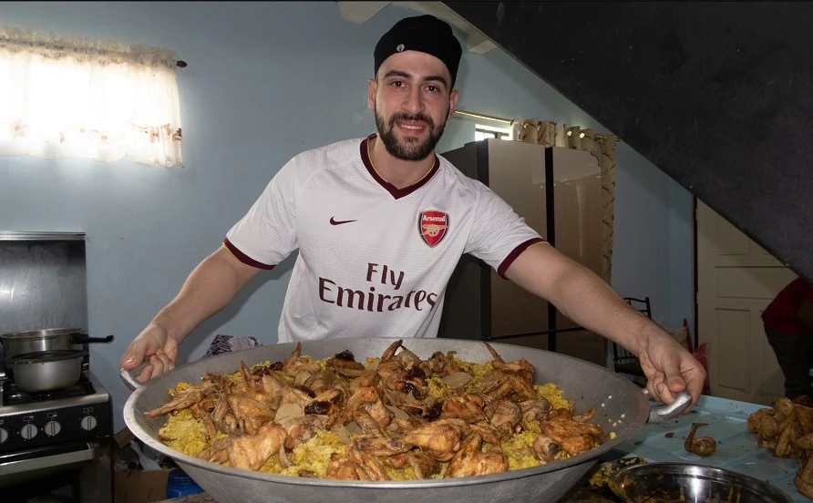 Fans praise Syrian vlogger as he cooks kabsa for Taal victims in the Philippines