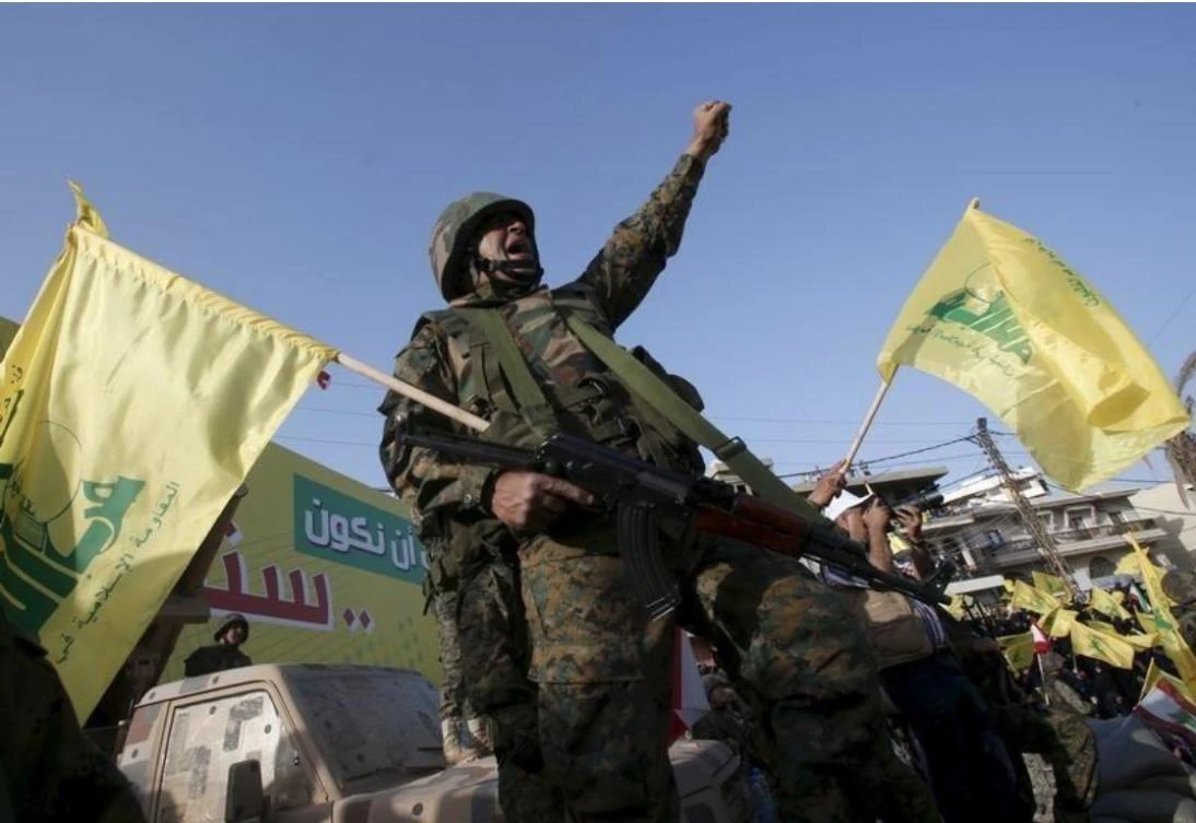 A Hezbollah member reacts while Hezbollah leader Sayyed Hassan Nasrallah talks on a screen during a televised speech at a festival celebrating Resistance and Liberation Day, in Nabatiyeh May 24, 2015. (Reuters)