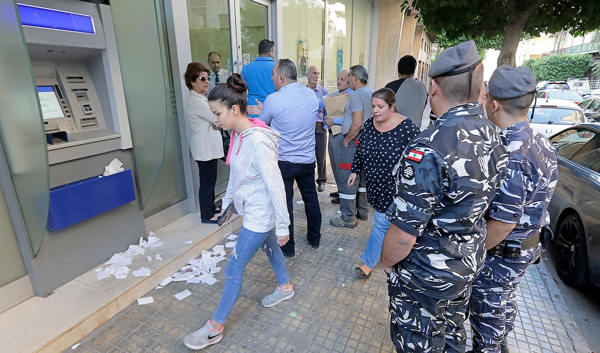 Depositors had withdrawn their deposits from banks at the start of the crisis and kept them at home, says money changer. (AFP)