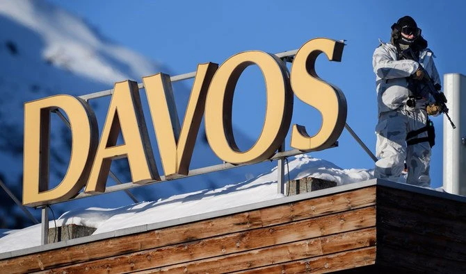 A policeman wearing camouflage clothing stands on the rooftop of a hotel near the Congress Centre during the World Economic Forum (WEF) annual meeting in Davos, on January 20, 2020. (AFP)