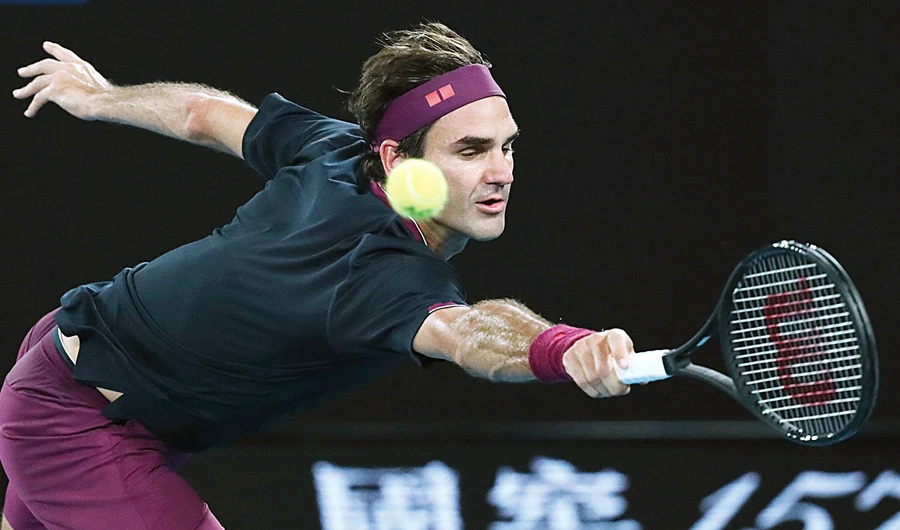 Switzerland’s Roger Federer makes a backhand return to Serbia’s Filip Krajinovic. (AP)