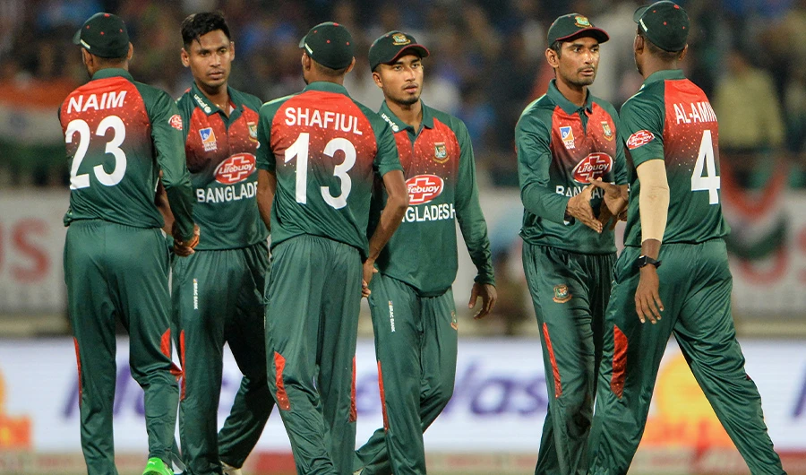 In this file photo, Bangladeshi team captain Mahmud Ullah (2R) shakes hand with team players after loosing the match during the 2nd T20 International cricket match of three-match series between Bangladesh and India, at the Saurashtra Cricket Association Stadium in Rajkot on November 7, 2019. (AFP)