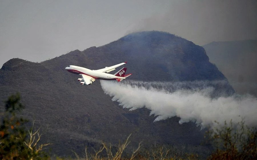 The blaze started Wednesday but strong winds and high temperatures caused conditions in Canberra to deteriorate. (File/AFP)