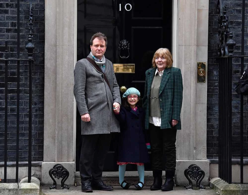Richard Ratcliffe (L), husband of British-Iranian aid worker Nazanin Zaghari-Ratcliffe jailed in Tehran since 2016, his daughter Gabriella (C) and his mother Barbara, pose outside of 10 Downing Street in central London on Jan. 23, 2020, as he arrives to meet with Britain’s Prime Minister Boris Johnson. (AFP)