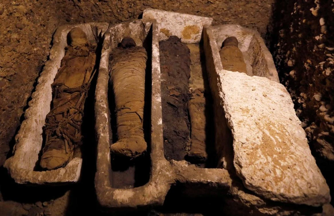Mummies are seen inside a tomb during the presentation of a new discovery at Tuna el-Gebel archaeological site in Minya Governorate, Egypt, February 2, 2019. (Reuters)