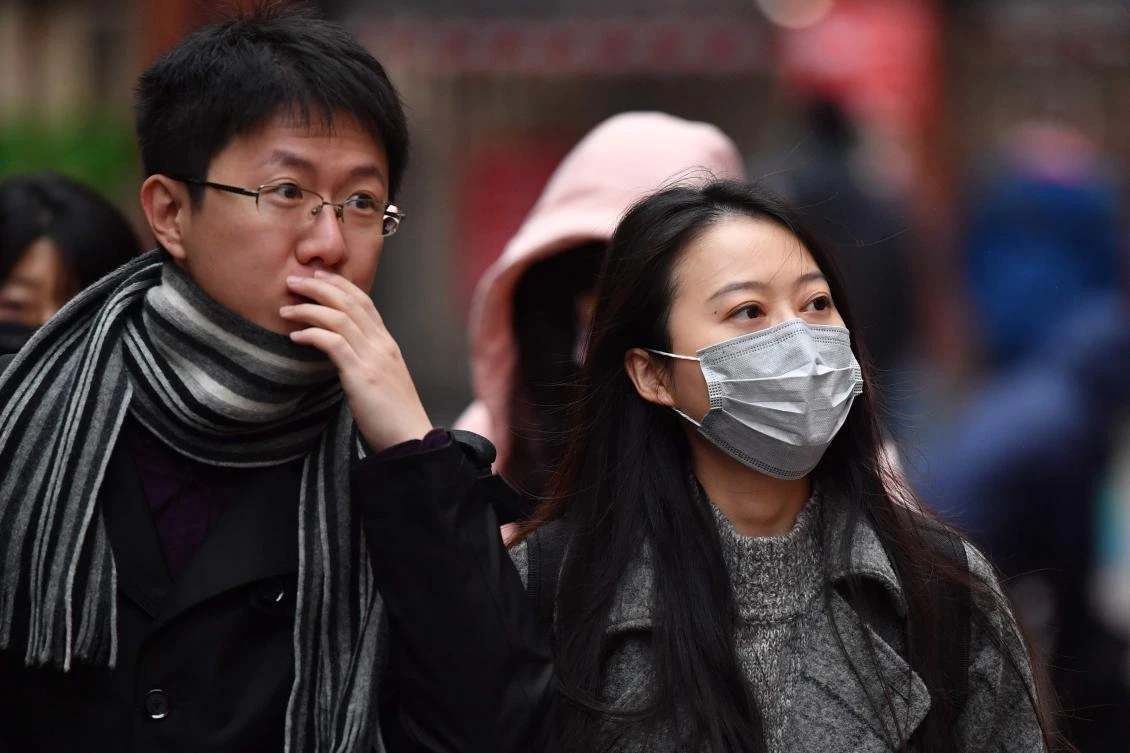 Pedestrians wear surgical masks in London's China Town. Everyone tested in Britain for a deadly virus that has infected hundreds in China, and spread to the US, has been given the all clear. (AFP)