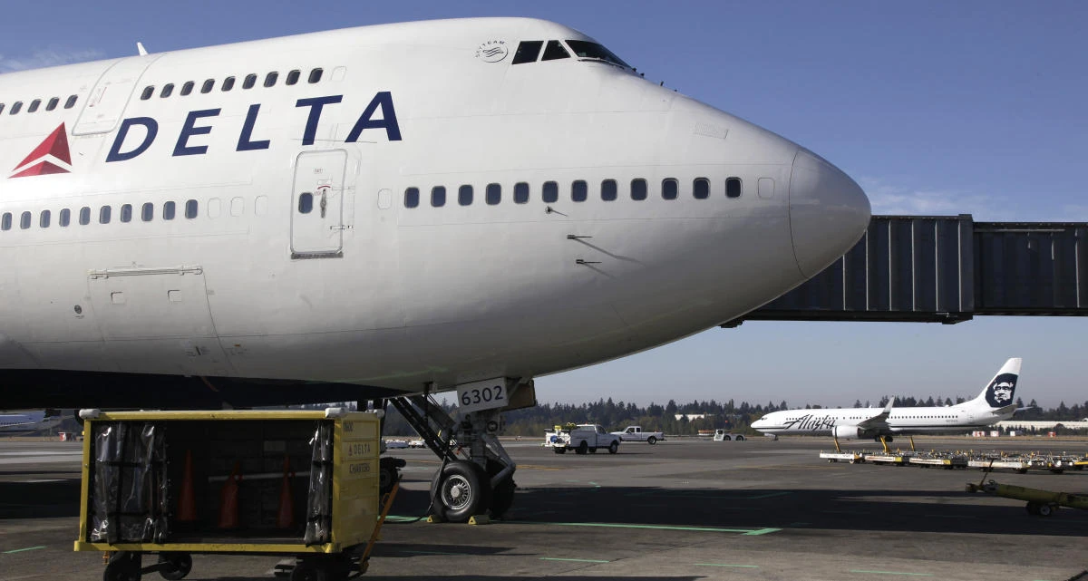 In this Oct. 9, 2012 file photo, Delta Air Lines 747-400 airplane sits parked at Seattle-Tacoma International Airport in Seattle. (AP)