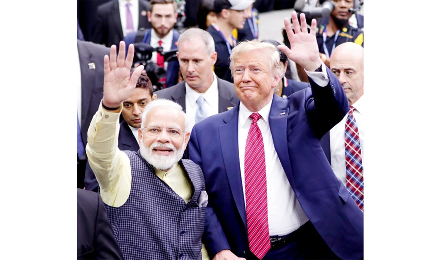 Indian Prime Minister Narendra Modi and US President Donald Trump wave to participants at a rally in Houston’s NRG Stadium late last year. (AP)