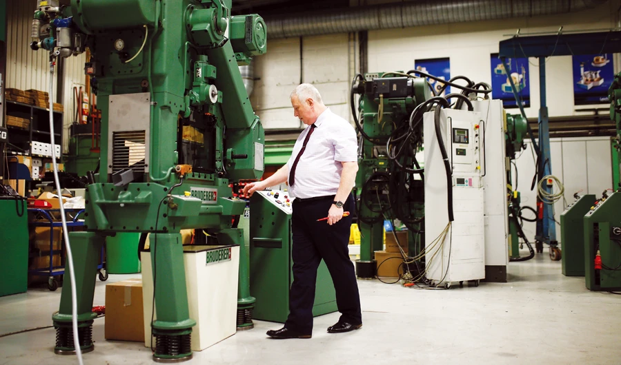 Mark Crawford, service manager of Bruderer UK Ltd, inspects a machine at the company’s factory in Luton. Businesses such as Bruderer in Britain are reporting a post-election recovery. (Reuters)