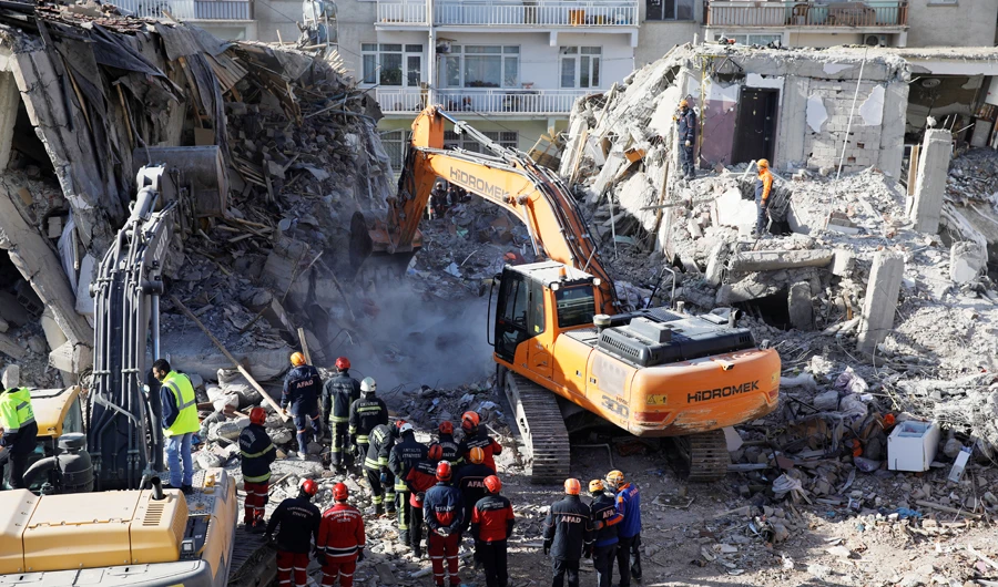 Search and rescue personnel work at the site of a collapsed building, after an earthquake with a magnitude of 6.8 in Elazig, Turkey, on Monday. (Reuters)
