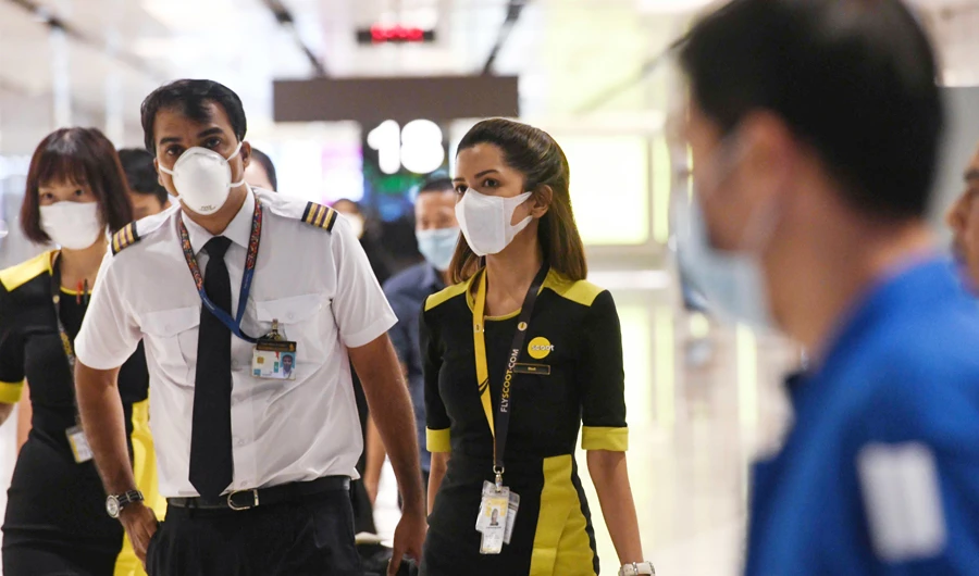 The flight crew of the chartered Scoot airline which flew to Wuhan to evacuate Singaporean nationals arrive at Changi international airport on Singapore on January 30, 2020. (AFP)