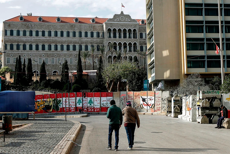 Beirut's Riad al-Solh Square has been sealed-off by graffiti-covered concrete barriers placed by Lebanese security forces to separate it from the nearby government palace. (AFP / JOSEPH EID)