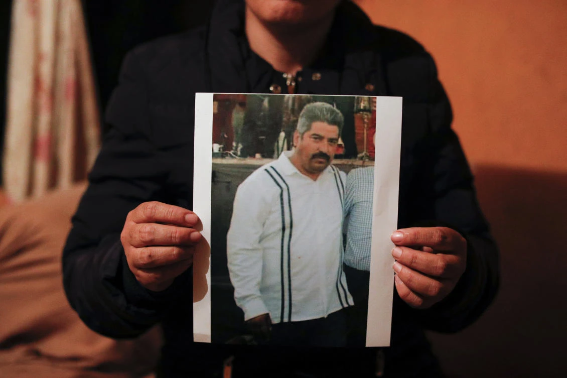 Rebeca Valencia Gonzalez holds up a picture of her husband, environmental activist Homero Gomez Gonzalez, in their home in Ocampo, Michoacan state, Mexico, Thursday, Jan. 30, 2020. (AP)