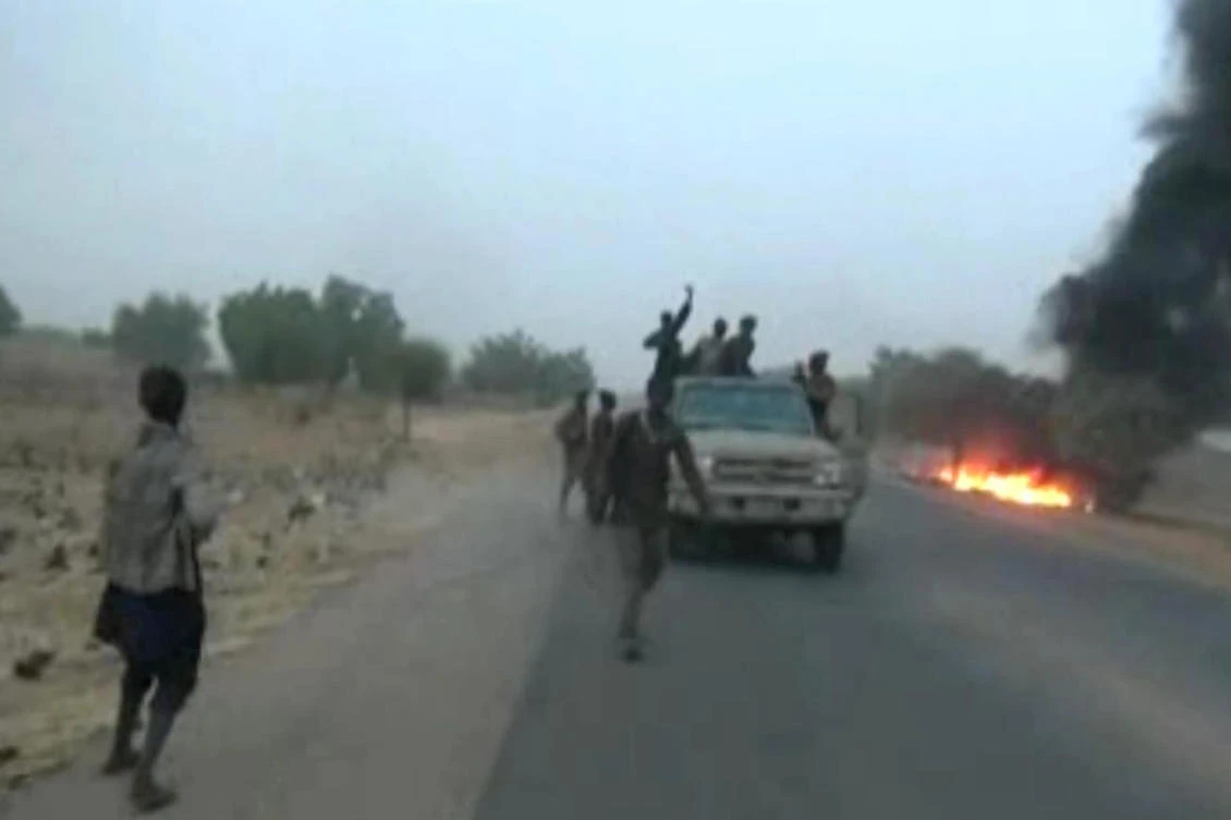 This screen grab image taken from a video released on January 2, 2018 by militant group Boko Haram shows Boko Haram fighters during a Christmas Day attack on a military checkpoint in Molai village on the outskirts of the northeast Nigerian city of Maiduguri. (AFP)